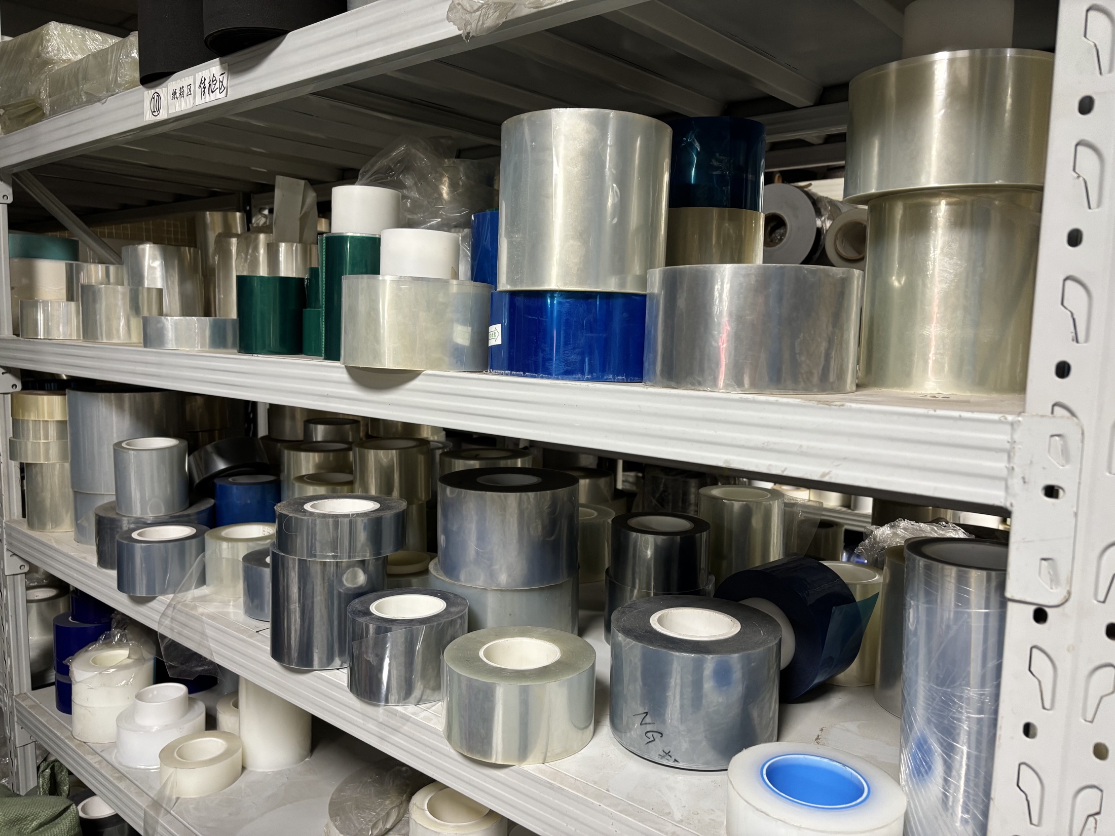 Label material rolls stored for incoming material inspection